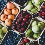 Summer fruit and berry assortment in wooden eco-friendly boxes